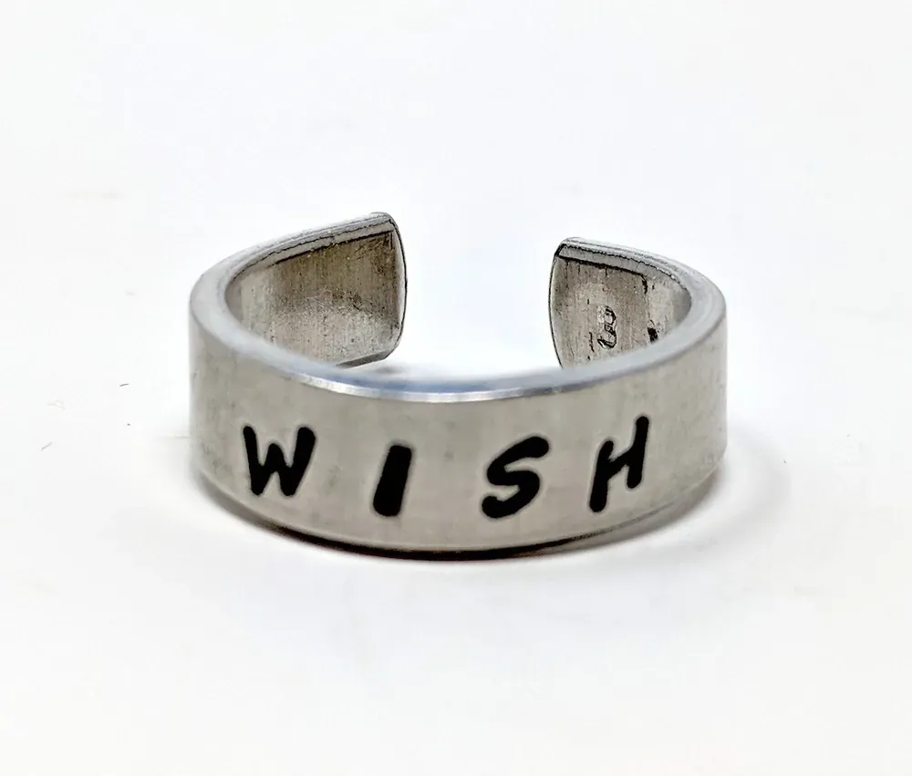 Molly's stamped aluminum ring that reads Wish