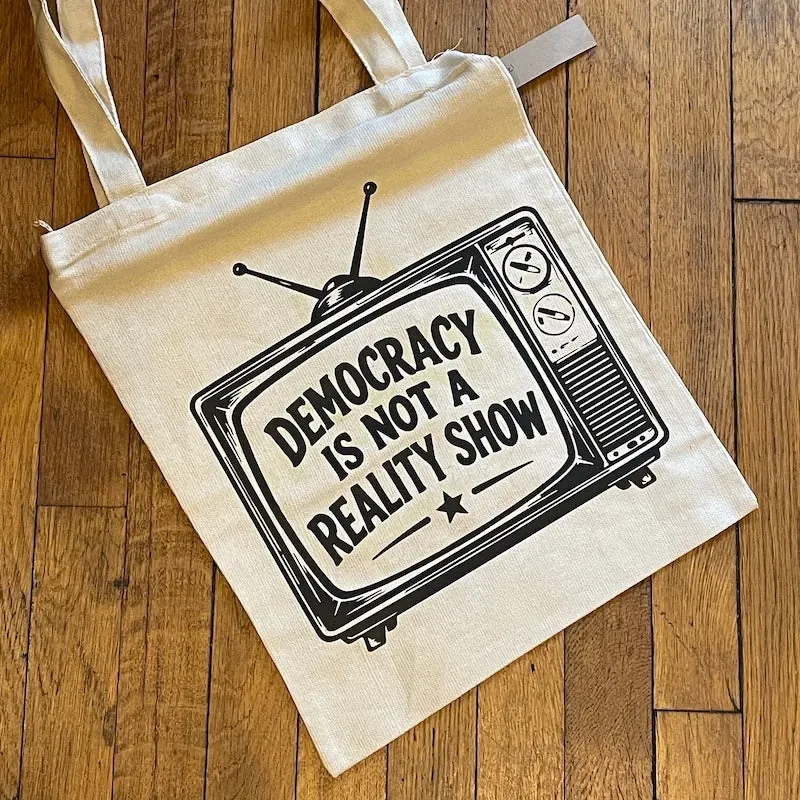 Democracy is Not a Reality Show by Backyard Swag
